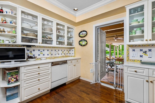 kitchen with white cabinetry, dark wood-type flooring, tasteful backsplash, crown molding, and white dishwasher