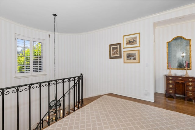 interior space featuring crown molding and hardwood / wood-style flooring