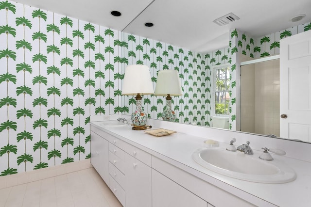 bathroom with vanity and walk in shower