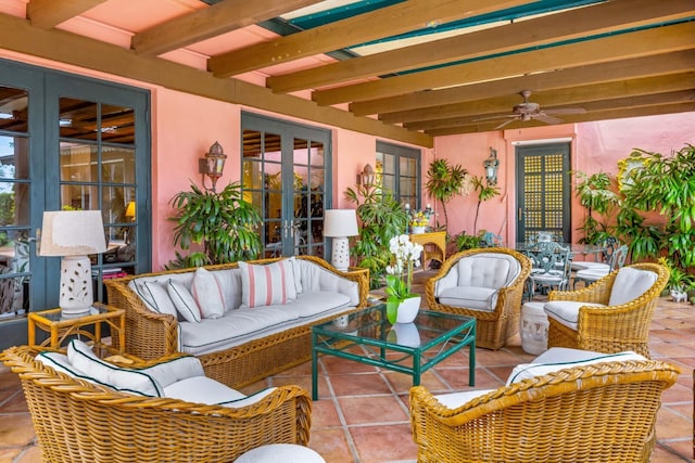 view of patio / terrace featuring ceiling fan, french doors, and an outdoor living space