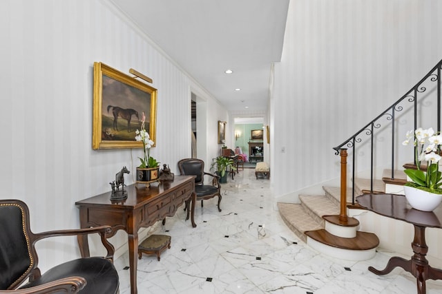 foyer entrance featuring ornamental molding