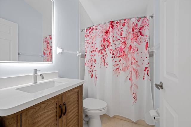 bathroom featuring vanity, toilet, walk in shower, and tile patterned floors