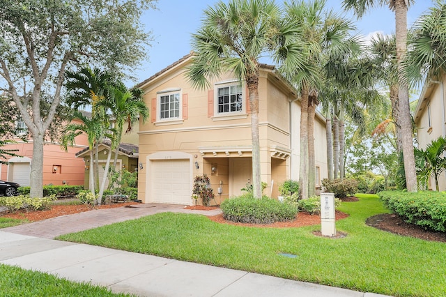 view of front facade with a garage and a front yard