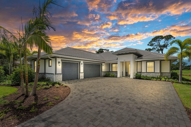 prairie-style house featuring a garage