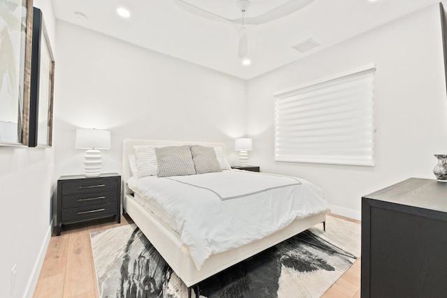 bedroom with light wood-type flooring and ceiling fan