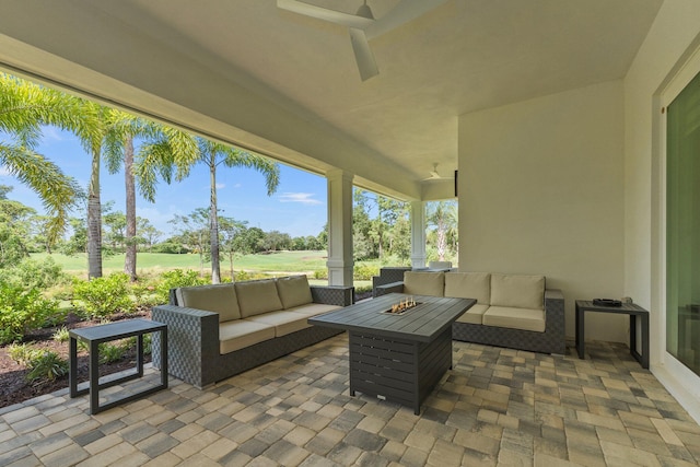 view of patio / terrace featuring an outdoor living space with a fire pit