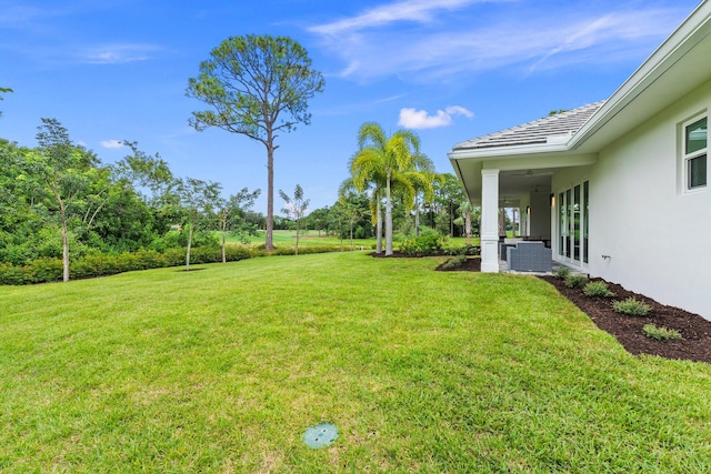 view of yard featuring central AC unit and a patio