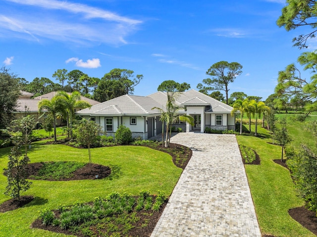 ranch-style home with a front lawn