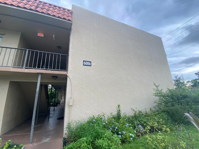 view of home's exterior with a balcony