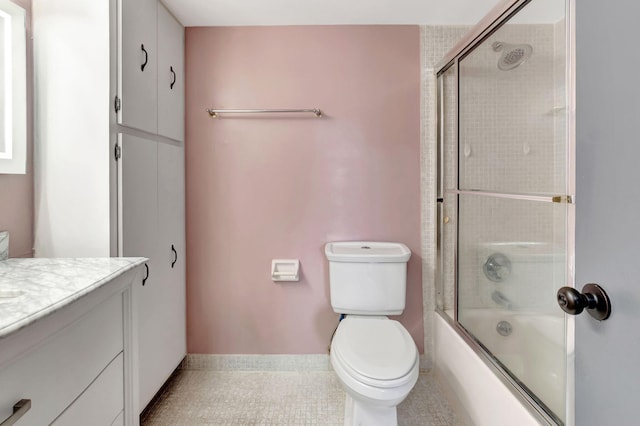 full bathroom featuring vanity, toilet, tile patterned floors, and enclosed tub / shower combo