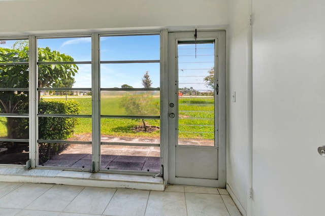 doorway featuring light tile patterned floors