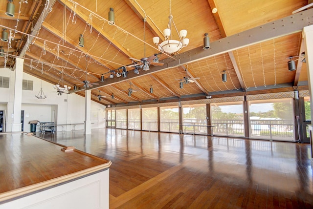 interior space with hardwood / wood-style floors, wood ceiling, a notable chandelier, high vaulted ceiling, and beam ceiling