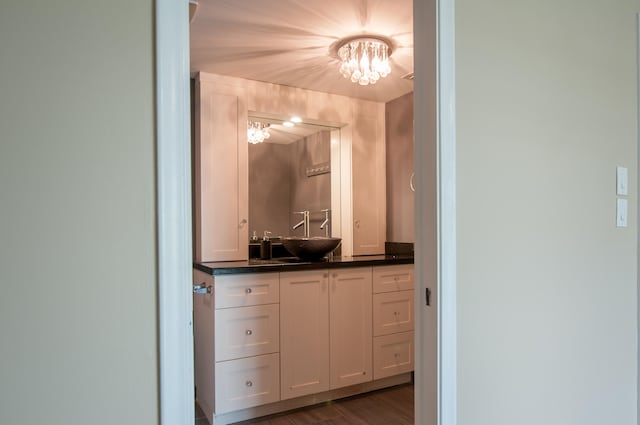 bathroom featuring vanity and wood-type flooring