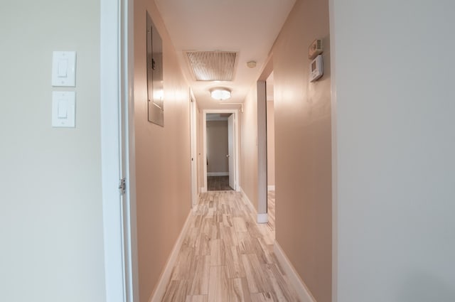 corridor featuring light hardwood / wood-style flooring