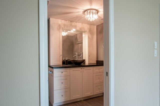 corridor featuring light wood-style floors, visible vents, and baseboards