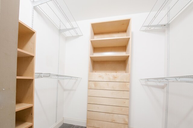 bathroom with a stall shower, tile patterned flooring, vanity, and toilet