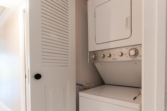 washroom with stacked washer / dryer