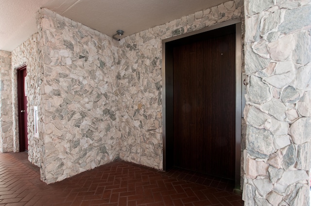 interior space featuring a textured ceiling