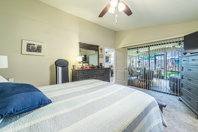 carpeted bedroom with a textured ceiling, access to outside, lofted ceiling, and ceiling fan