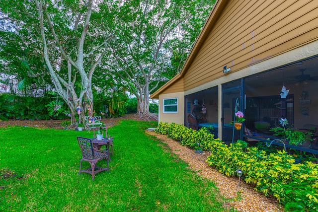 view of yard with a sunroom