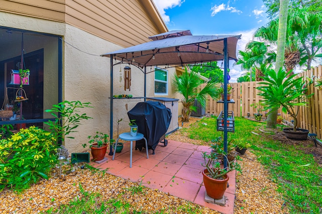 view of patio / terrace with a gazebo and a grill