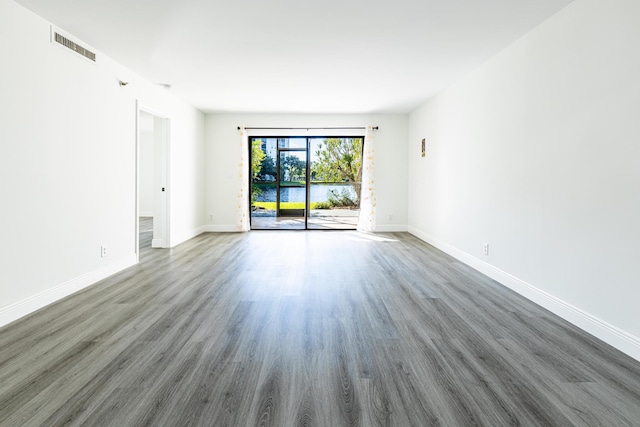 empty room featuring dark wood-type flooring