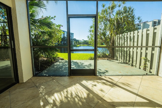 doorway to outside featuring a water view