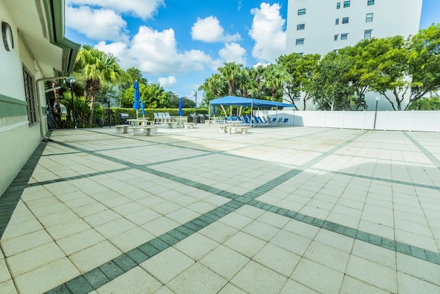 view of home's community with a patio area