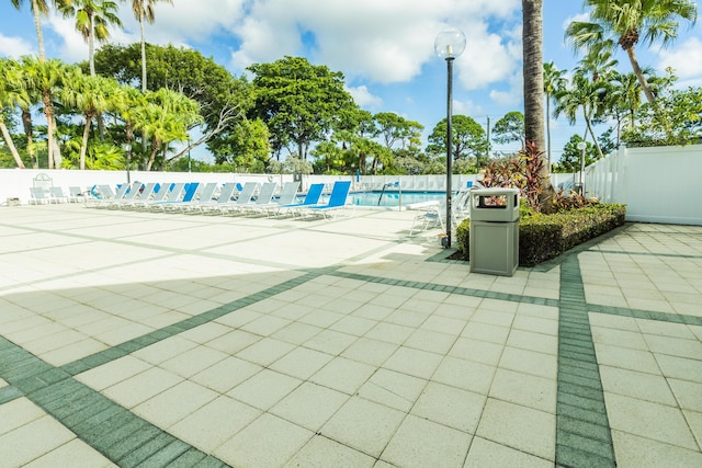 exterior space featuring a swimming pool and a patio area