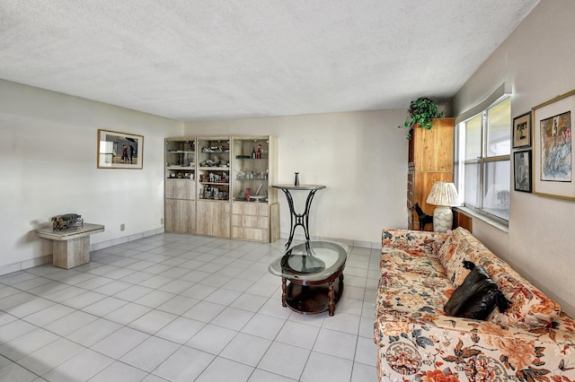 tiled living room with a textured ceiling