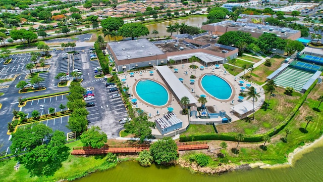 birds eye view of property with a water view