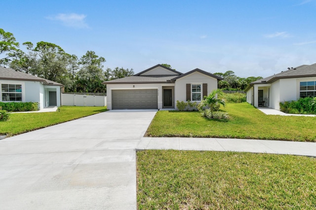 single story home with a garage and a front yard