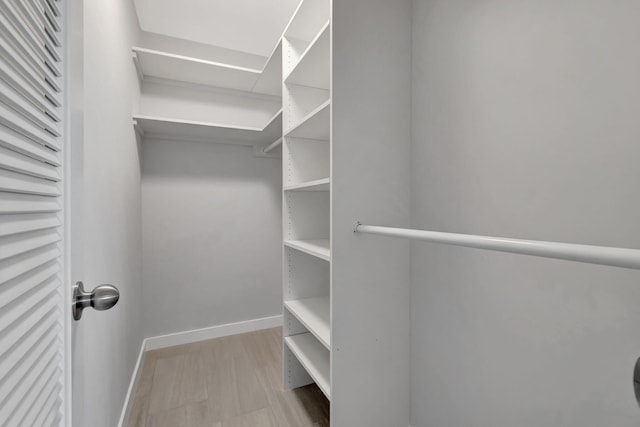 164 Normandy D, Delray Beach, FL 33484 - walk in closet with wood finished floors