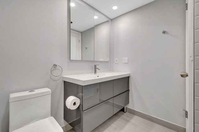 164 Normandy D, Delray Beach, FL 33484 - bathroom featuring recessed lighting, vanity, toilet, and baseboards