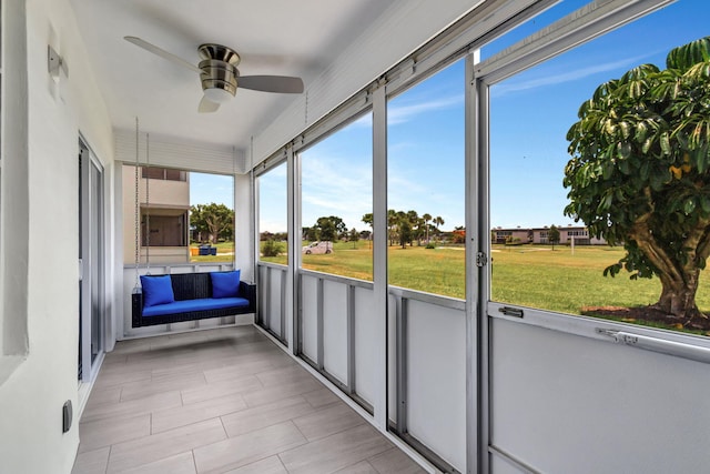 164 Normandy D, Delray Beach, FL 33484 - unfurnished sunroom featuring a ceiling fan