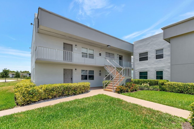 164 Normandy D, Delray Beach, FL 33484 - view of building exterior with stairs