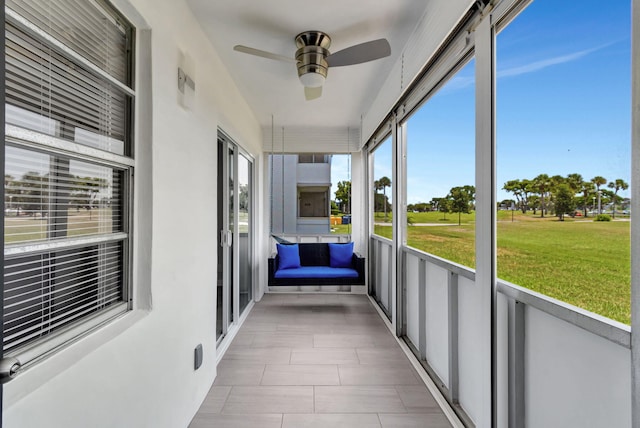 164 Normandy D, Delray Beach, FL 33484 - unfurnished sunroom with ceiling fan