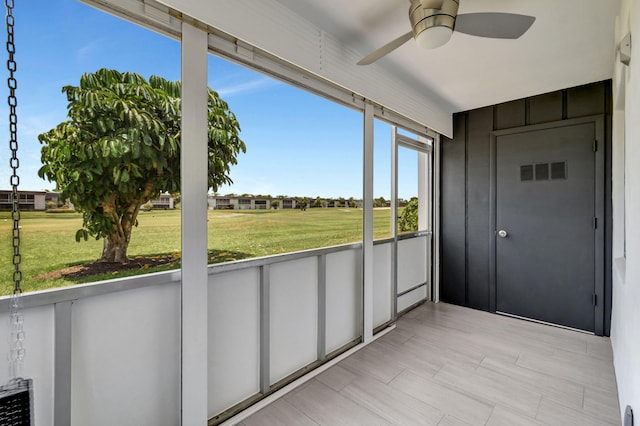 164 Normandy D, Delray Beach, FL 33484 - unfurnished sunroom featuring ceiling fan and visible vents