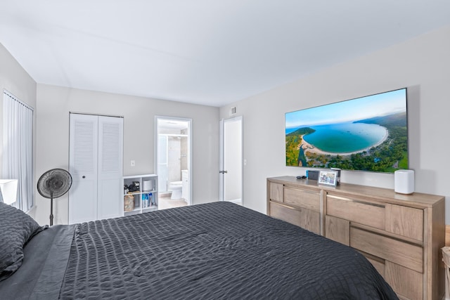 bedroom featuring ensuite bath and a closet