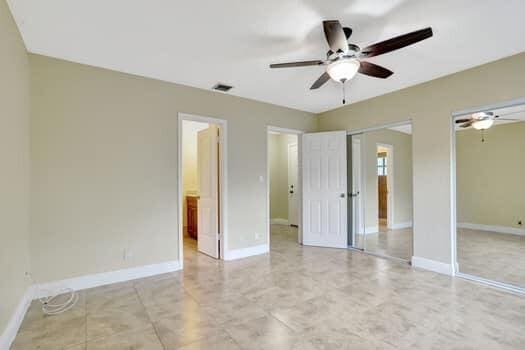 unfurnished bedroom featuring ceiling fan