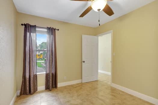 spare room with ceiling fan