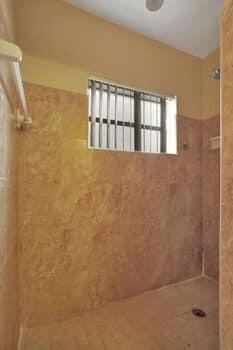 bathroom with tiled shower