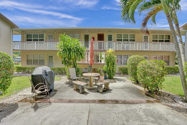 exterior space with a patio area and a balcony