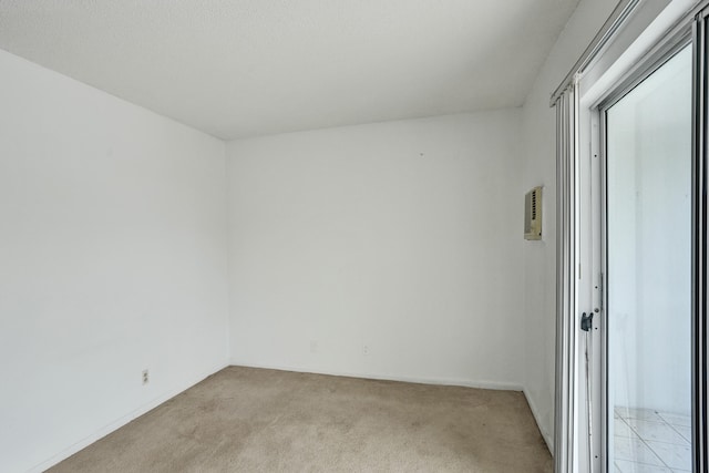 unfurnished room with light colored carpet