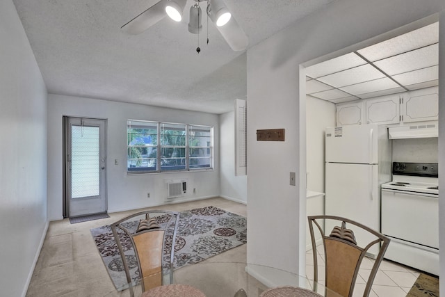 kitchen featuring white cabinetry, white appliances, light tile patterned floors, and ceiling fan