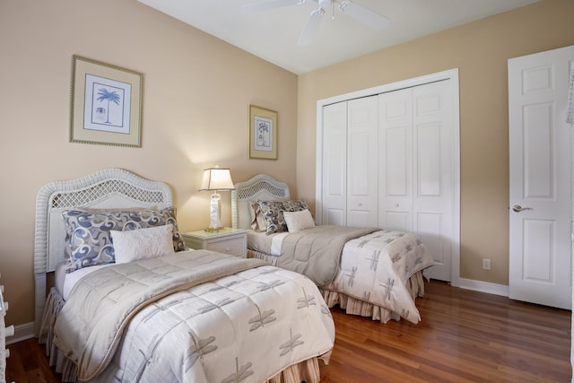 bedroom featuring ceiling fan, a closet, and dark hardwood / wood-style flooring