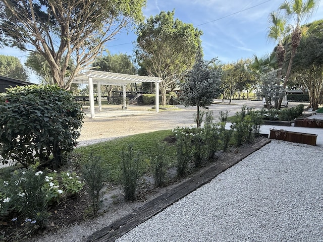 view of yard with a pergola