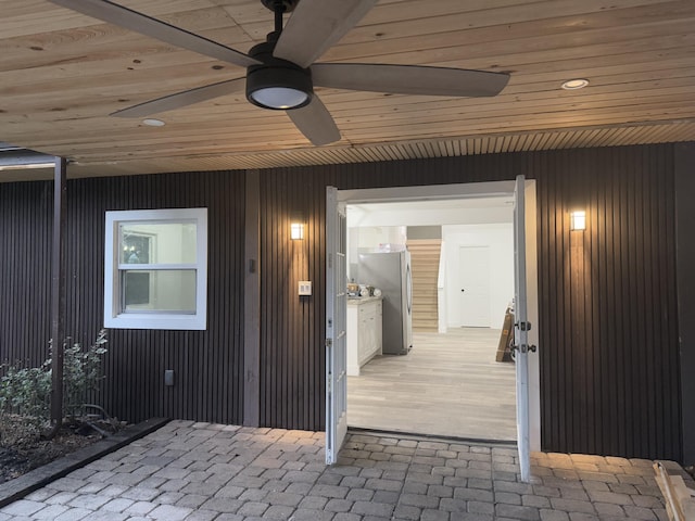 entrance to property with ceiling fan