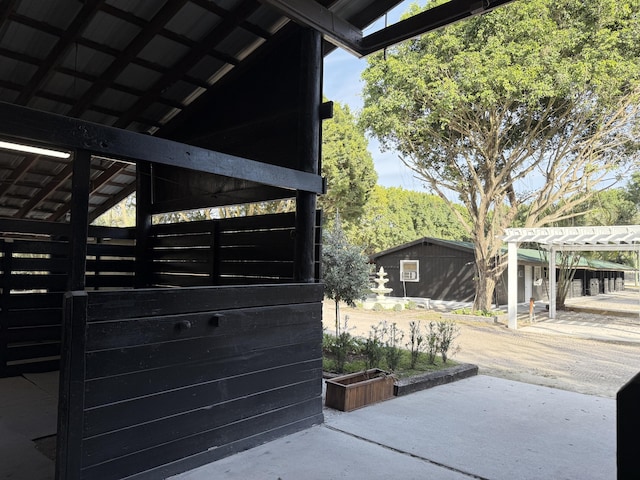 exterior space featuring an outdoor structure and a pergola