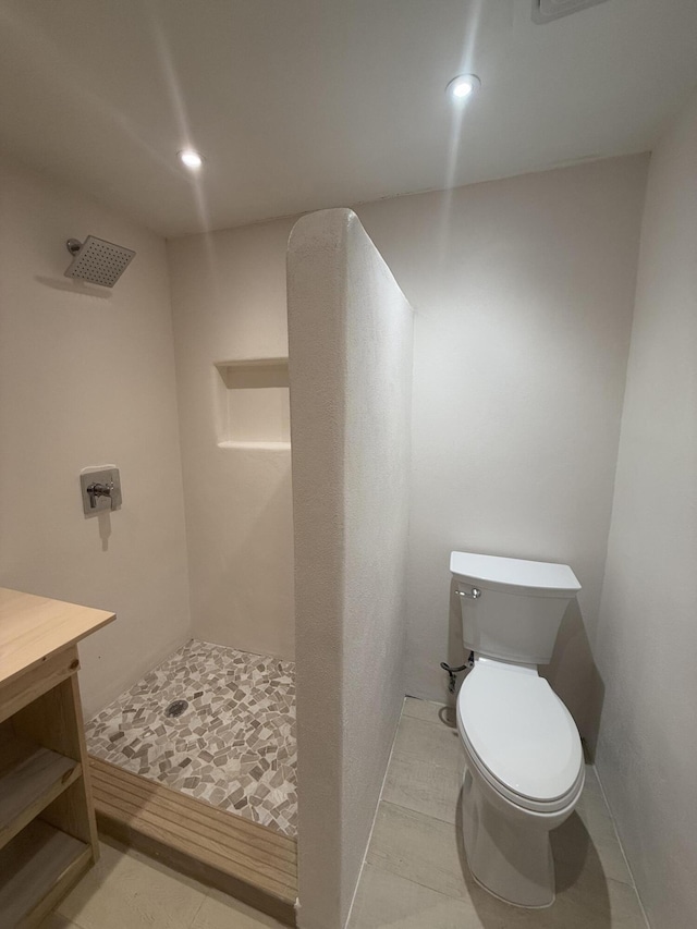 bathroom featuring recessed lighting, a shower stall, and toilet